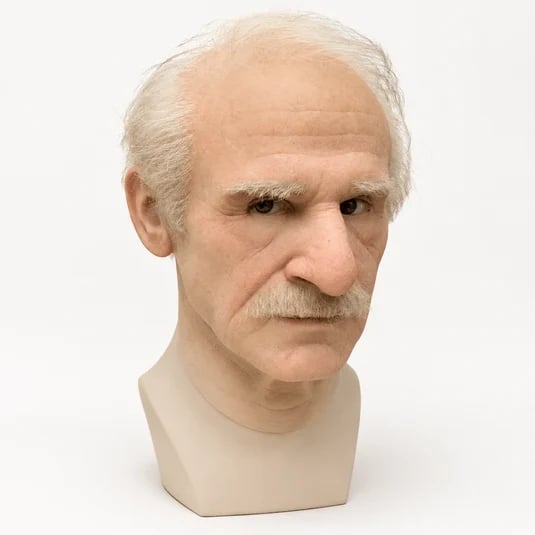 Detailed white-haired elderly-character mask on display