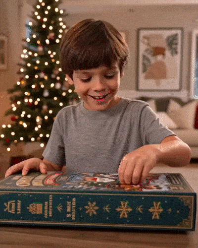 A child opens the Christmas Advent calendar box.