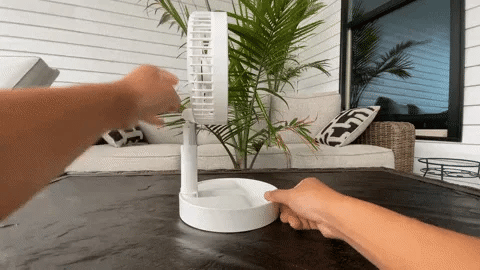 portable folding fan in use