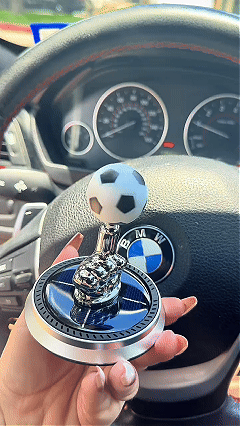 Solar rotating soccer ball dashboard ornament in a car
