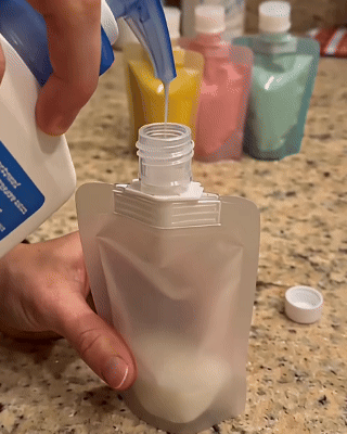 Demonstration of filling and using a soft 50ml reusable travel liquid pouch