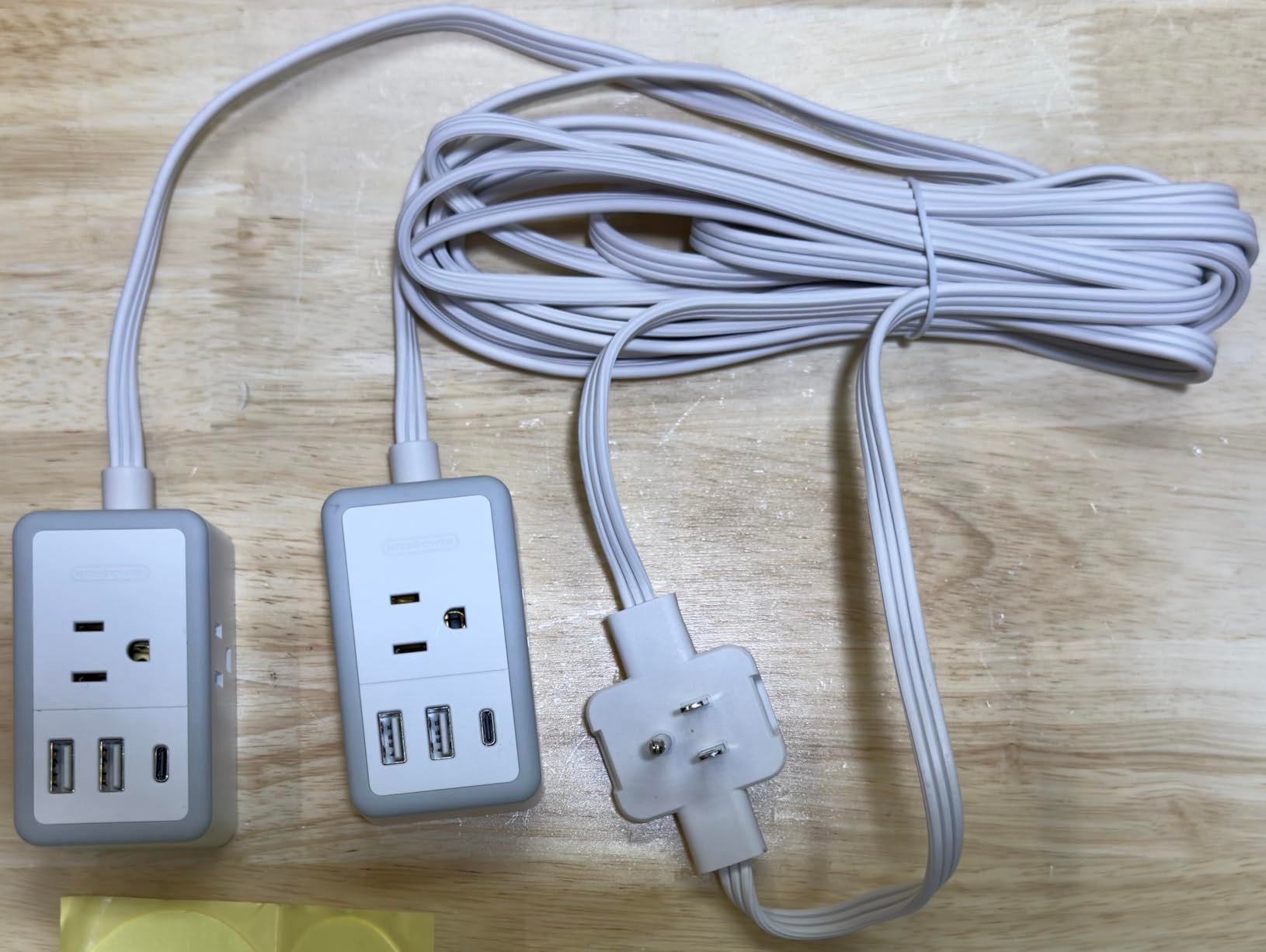 Flat plug splitter that finally solves the all too common "outlet behind sofa" dilemma