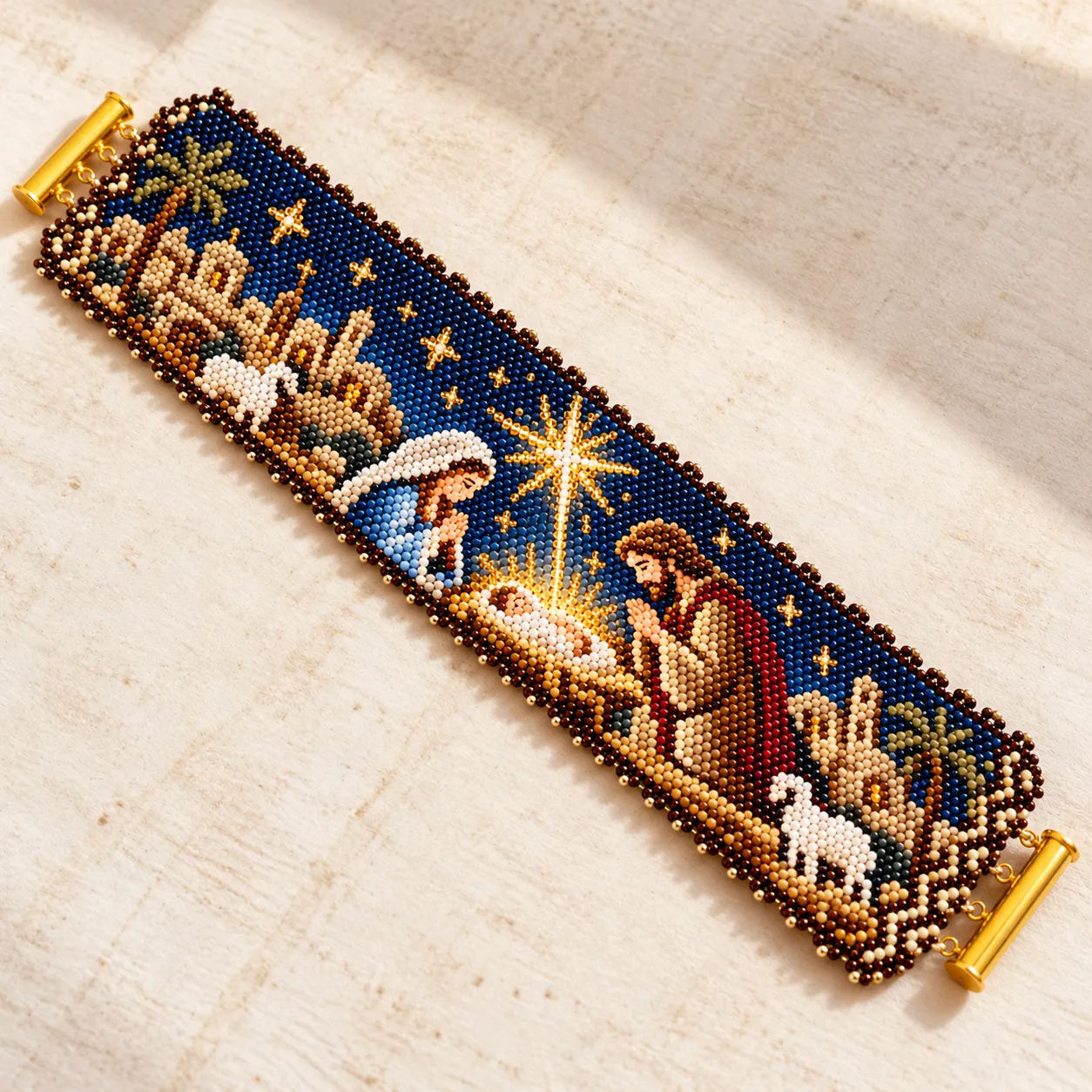 Full flat view of the detailed beaded cuff with gold metal clasp