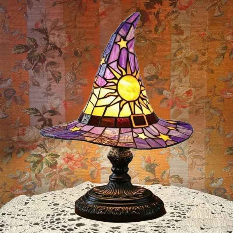 Witch hat lamp styled with autumn decor and candles