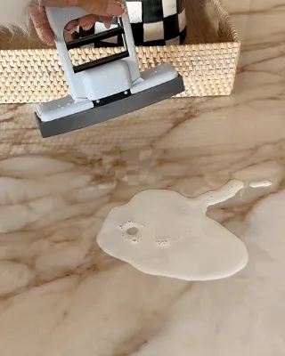 Handheld mini mop wiping and squeezing in use