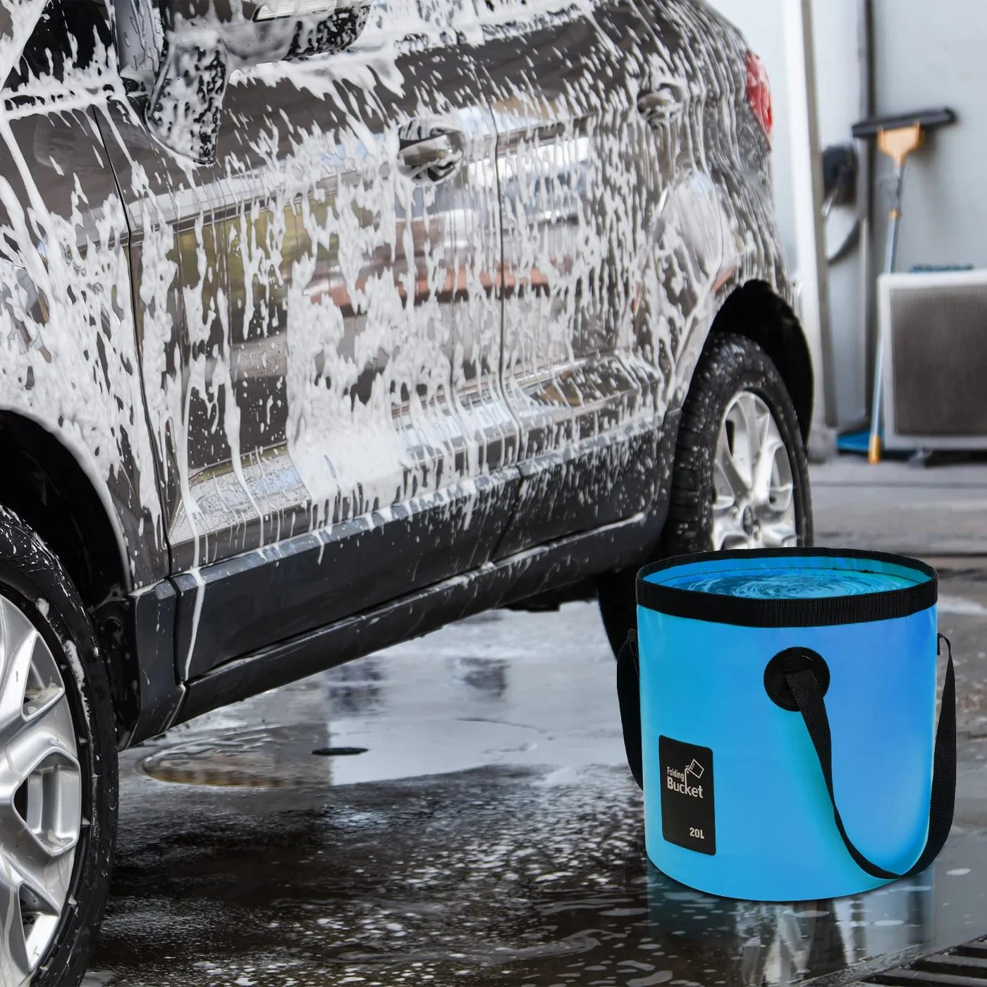 Blue foldable bucket used for washing a car