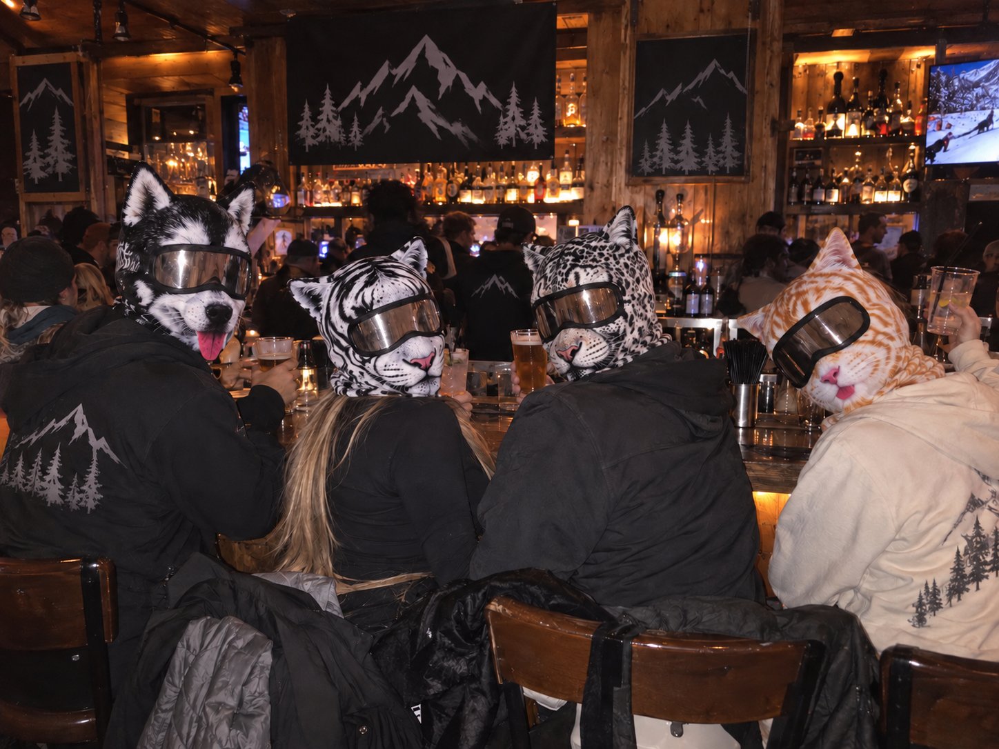 Friends wearing animal ski masks together