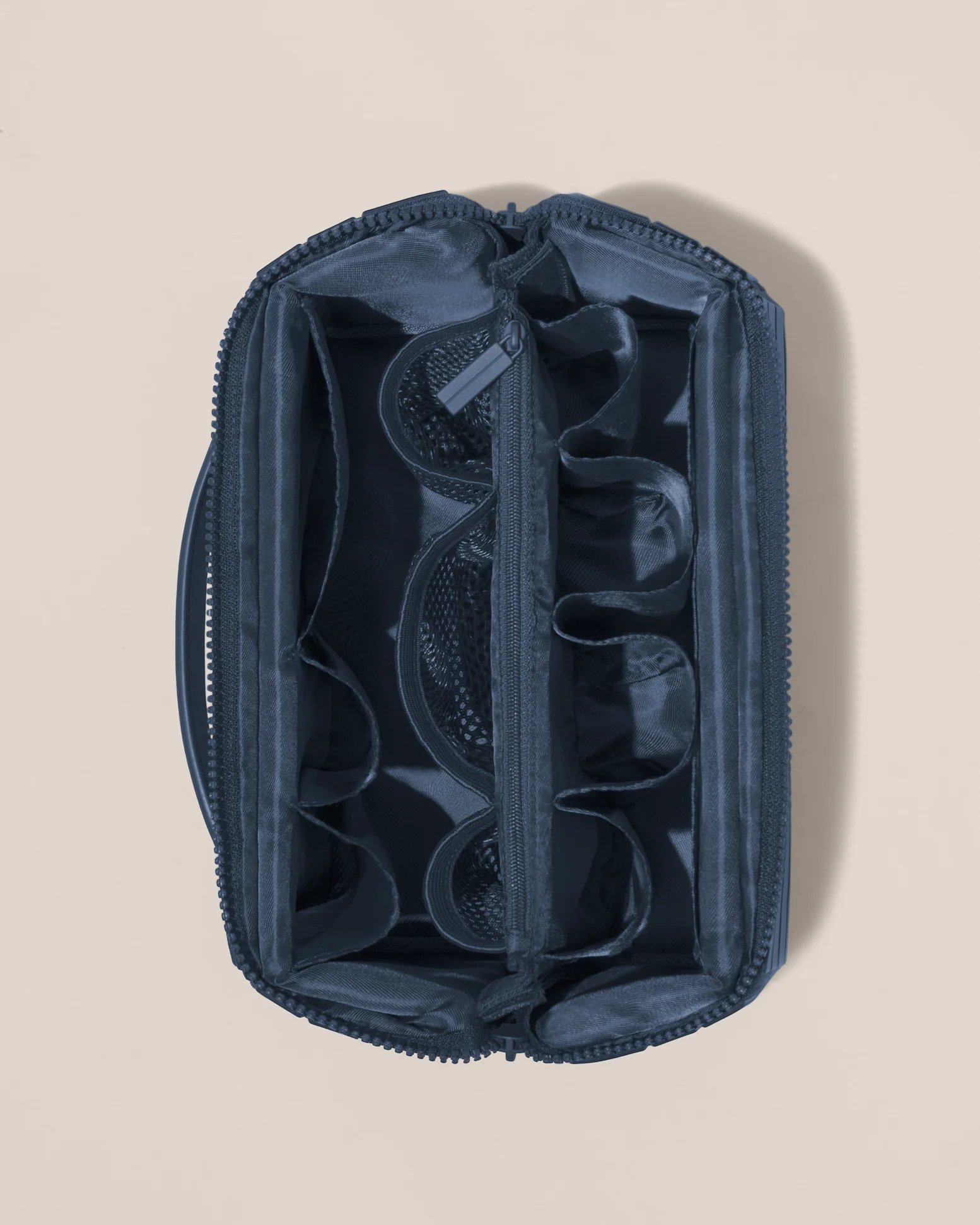 Interior view of the travel kit with mesh pockets