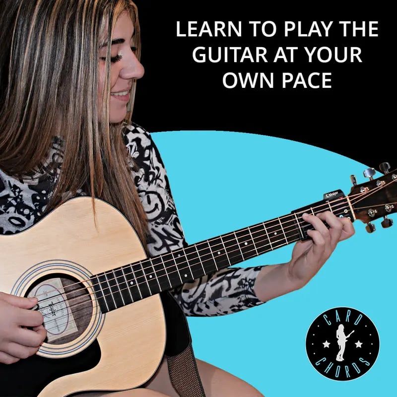Guitarist using chord cards